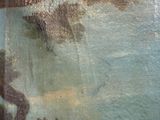 a painting on the wall of a building with a clock on it