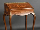 an old wooden desk with a drawer on top of it