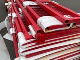 a lot of red and white items stacked on top of each other