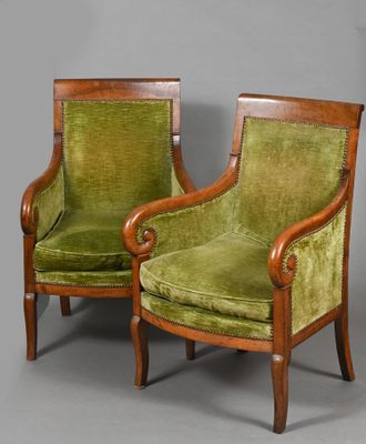 pair of green velvet armchairs with wood frame and arms