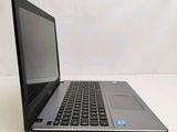a laptop computer sitting on a table with a white background