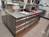 a large stainless steel counter in a commercial kitchen