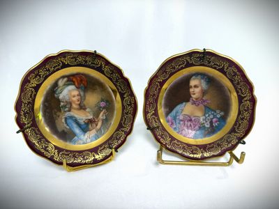 pair of hand painted porcelain portraits of a lady and a gentleman