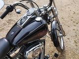 a motorcycle that is parked on the side of the road