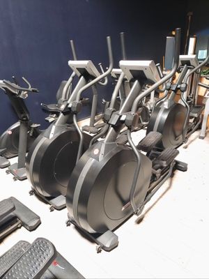 many different types of exercise bikes in this room