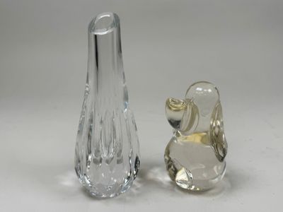 two glass vases sitting next to each other on a table