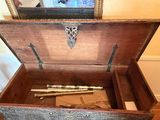 a wooden box with a baseball bat inside of it