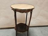 a small table with a marble top on it