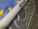 a hospital bed with a blue cover and yellow flowers on it