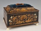 a wooden box that has a blue velvet on it