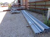 a lot of steel beams that are sitting on the ground
