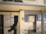 an image of a jail cell with a door open