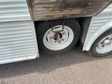 a close up of a trailer with a dog inside of it