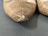 a close up of a pair of shoes on a table