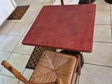 a table and chairs in a room with tile flooring