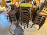many chairs and stools in a room with a table