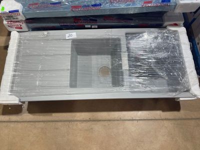 a laptop computer sitting on top of a plastic box