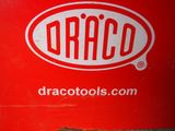 a red trash can with the word traco on it