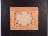 wooden picture frame with a star cut out of it