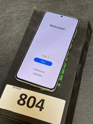 an open box with a phone sitting on top of it