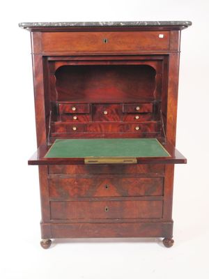 an old wooden desk with a green top and drawers
