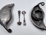 two spoons and a spoon rest on a table