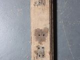 a piece of wood with holes in it on a table