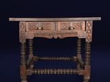 an old wooden table with two drawers on top of it