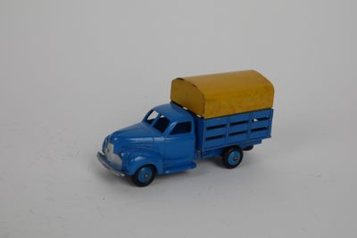 a toy truck with a box on the back of it