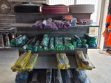 many bags of food on the shelf in the garage