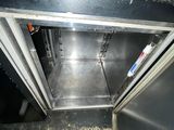 an open door to an oven that is sitting in the floor