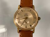 an image of a wrist watch with a brown leather strap