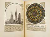 un livre ouvert sur lequel figurent une cathédrale et une tour horloge