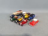several toy cars are lined up in a row on a gray surface