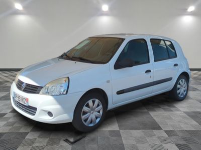 a picture of a white car parked in a garage