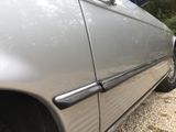 a car that is parked on a gravel road