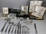 an assortment of silverware including forks, spoons, and knives