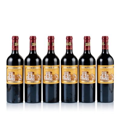 six bottles of red wine lined up in a row