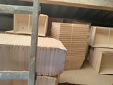 boxes stacked on top of each other in a storage area