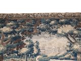 a large tapestry with a bird on it in the middle of a room