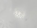 a white plate with a clock in the middle of it