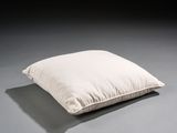 an image of a white pillow sitting on top of a gray floor