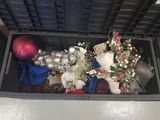 a box with a bunch of christmas decorations inside of it