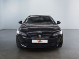 the front view of a black car in a white room