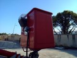 a large red box sitting on top of a tripod