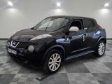 a picture of a black nissan juke is on a checkered floor