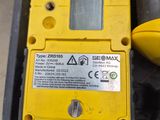 a close up of a yellow electronic device on a table