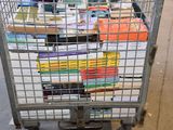 a shopping cart full of books on the street