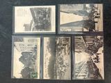 several old black and white photos of a street and buildings