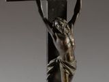 a close up of a statue of a person on a cross
